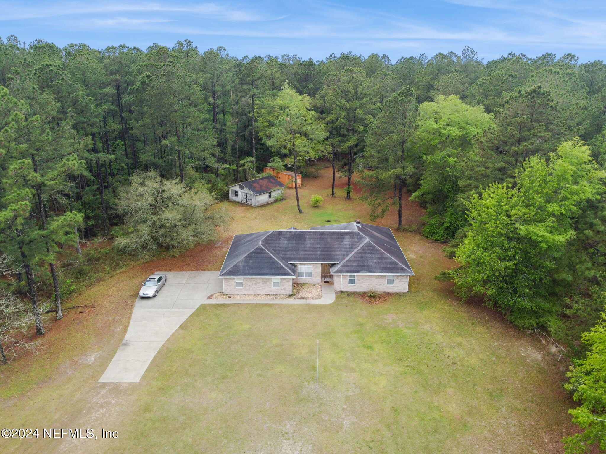 36068 J W Elliott Road Callahan, FL 32011 - Photo 48 of 54 an aerial view of a house with a yard