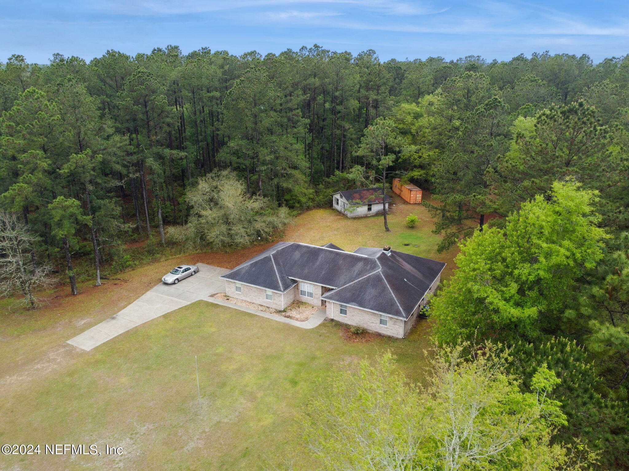 36068 J W Elliott Road Callahan, FL 32011 - Photo 49 of 54 a view of a swimming pool with a yard