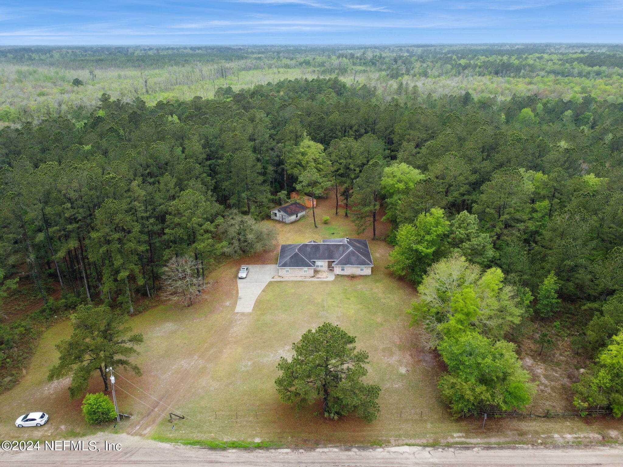36068 J W Elliott Road Callahan, FL 32011 - Photo 51 of 54 a view of a yard with an outdoor space