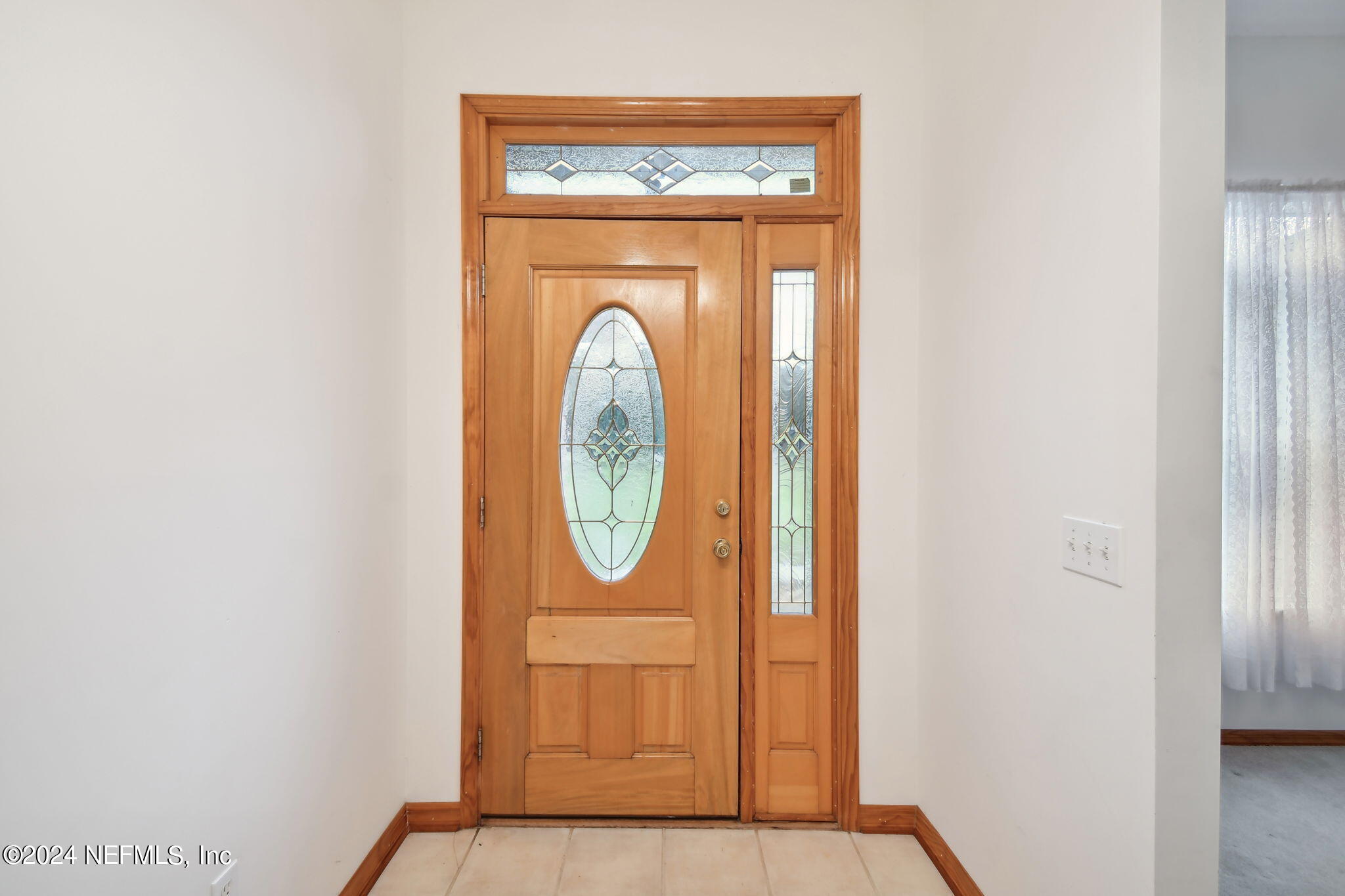 36068 J W Elliott Road Callahan, FL 32011 - Photo 7 of 54 a view of entryway with wooden floor