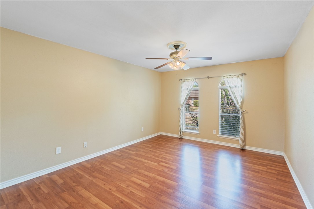 5121 Moultrie Drive Corpus Christi, TX 78413 - Photo 11 of 13 wooden floor in an empty room with a window