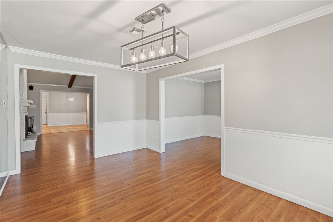 5121 Moultrie Drive Corpus Christi, TX 78413 - Photo 5 of 13 wooden floor in an empty room with a window