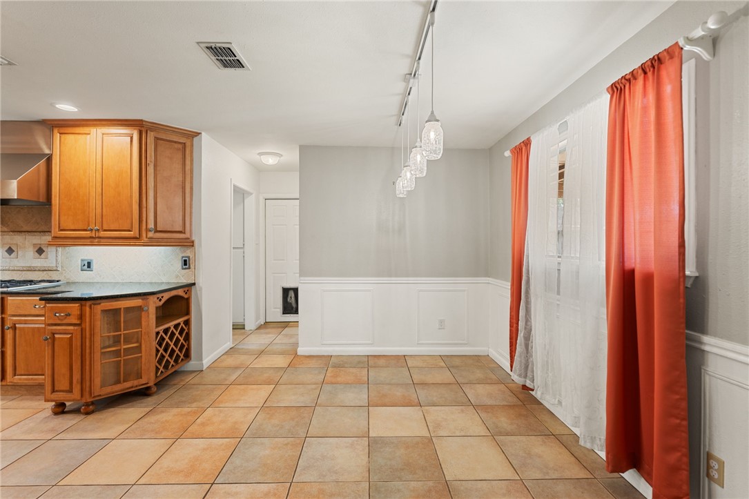5121 Moultrie Drive Corpus Christi, TX 78413 - Photo 6 of 13 a large kitchen with stainless steel appliances a counter space and a window