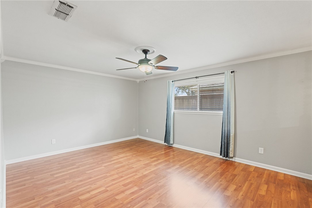 5121 Moultrie Drive Corpus Christi, TX 78413 - Photo 9 of 13 a big room with wooden floor closet and chandelier fan