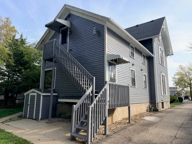 a front view of a house with garage