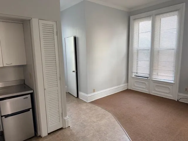 a view of an empty room with a window