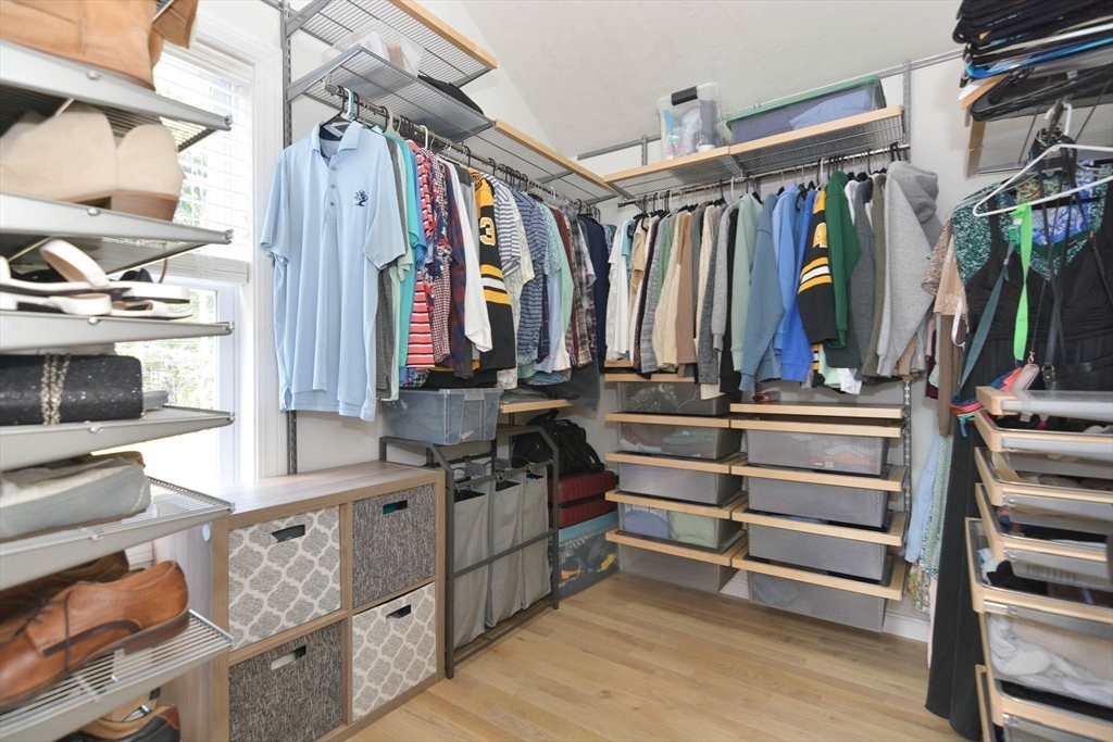 57 Parham Road Tyngsborough, MA 01879 - Photo 17 of 42 a view of walk in closet with clothes and shoes