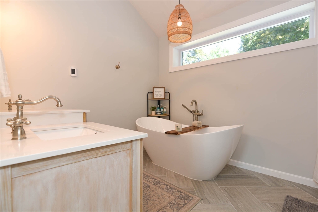 57 Parham Road Tyngsborough, MA 01879 - Photo 19 of 42 a bathroom with a sink and a mirror