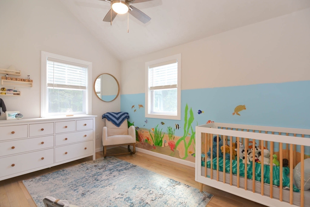 57 Parham Road Tyngsborough, MA 01879 - Photo 24 of 42 a bedroom with furniture a baby crib and a window