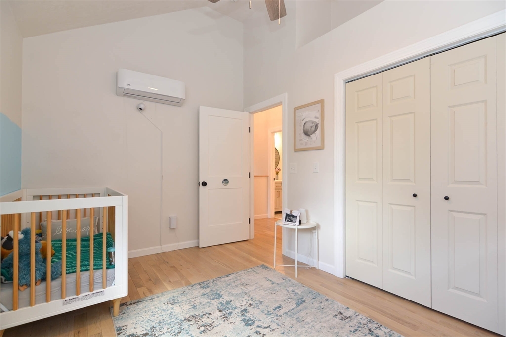 57 Parham Road Tyngsborough, MA 01879 - Photo 25 of 42 a view of a hallway with wooden floor and a bathroom