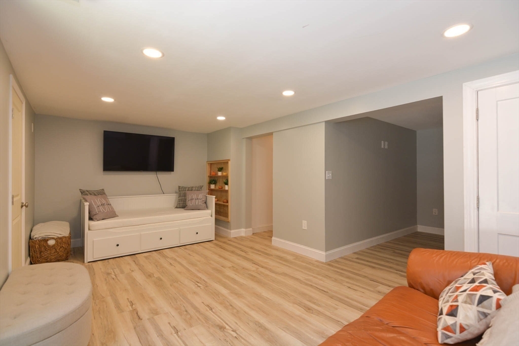 57 Parham Road Tyngsborough, MA 01879 - Photo 29 of 42 a bedroom with a bed and a flat screen tv