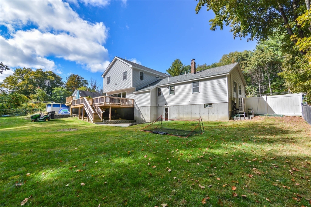 57 Parham Road Tyngsborough, MA 01879 - Photo 34 of 42 a view of a back yard of the house