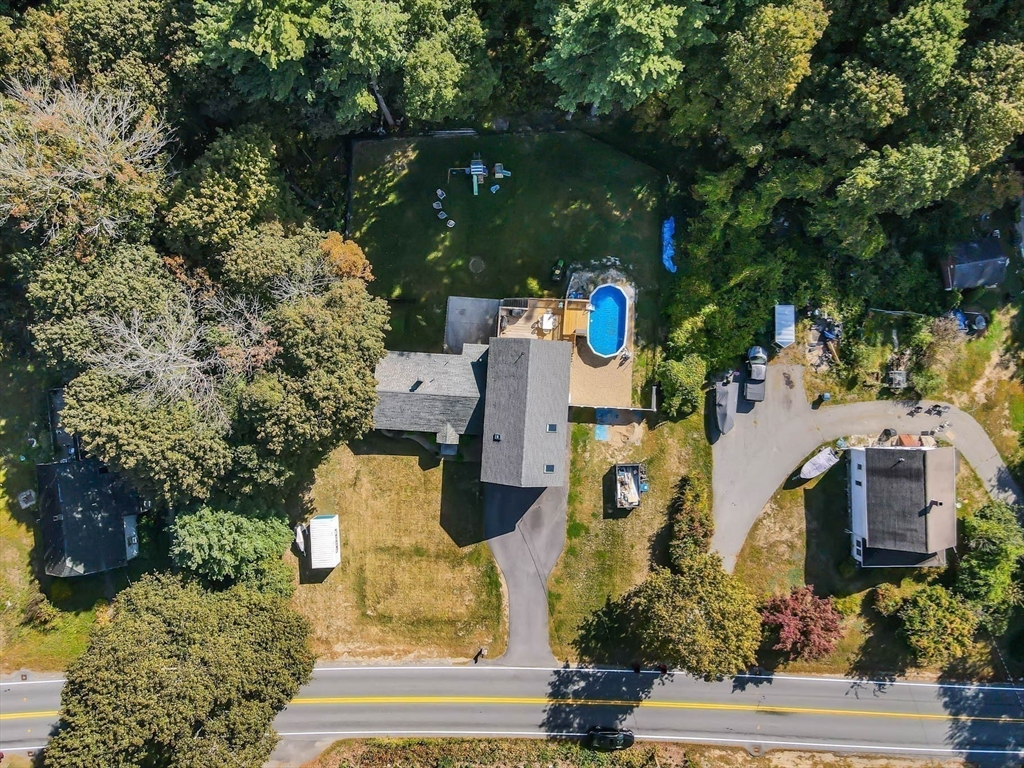 57 Parham Road Tyngsborough, MA 01879 - Photo 36 of 42 an aerial view of multiple houses with yard