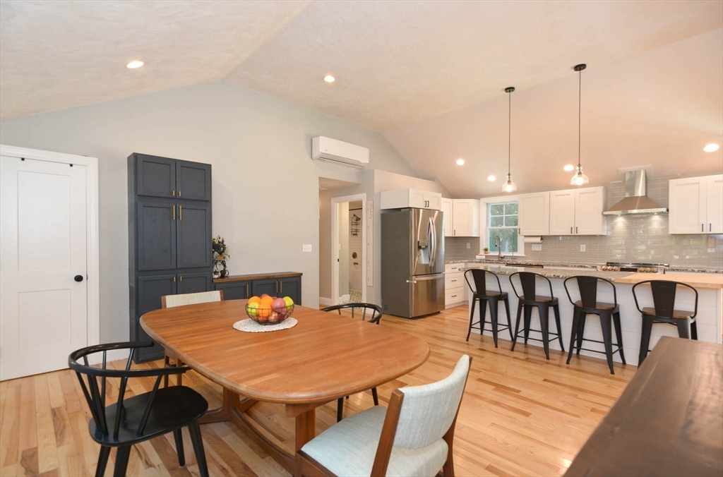 57 Parham Road Tyngsborough, MA 01879 - Photo 6 of 42 a dining room with furniture and wooden floor