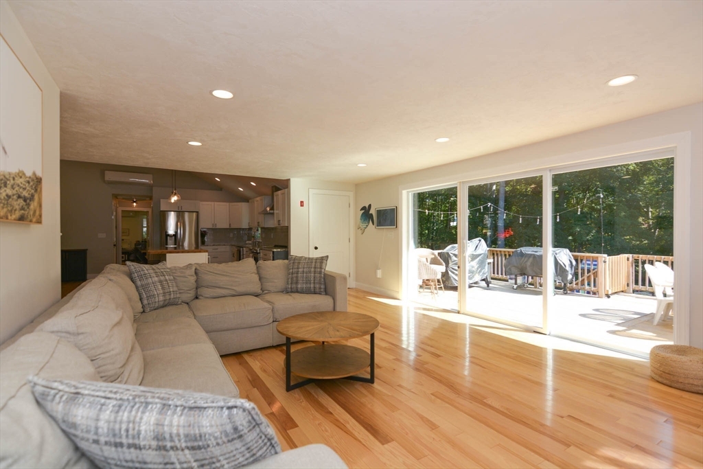 57 Parham Road Tyngsborough, MA 01879 - Photo 9 of 42 a living room with furniture and a large window