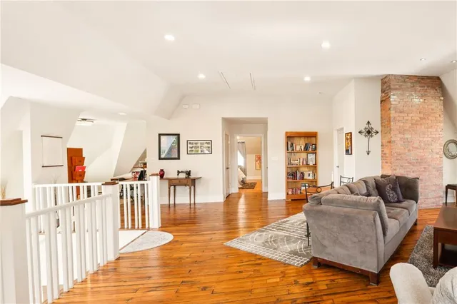 a bedroom with bed tv and table