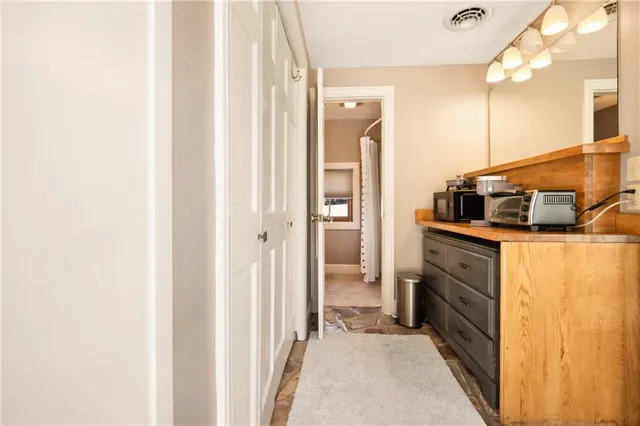 a bathroom with a sink a toilet and a window