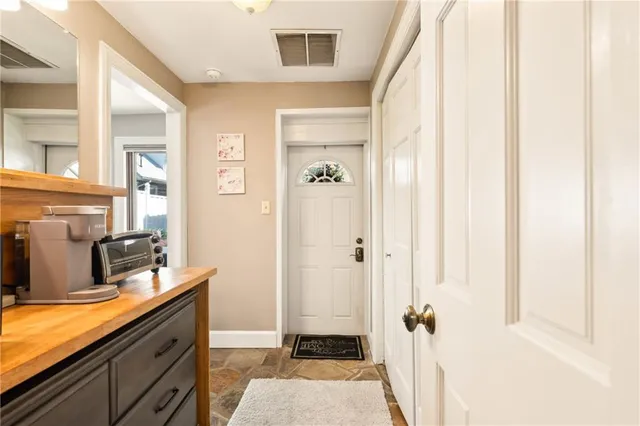 an aerial view of residential houses with outdoor space and swimming pool