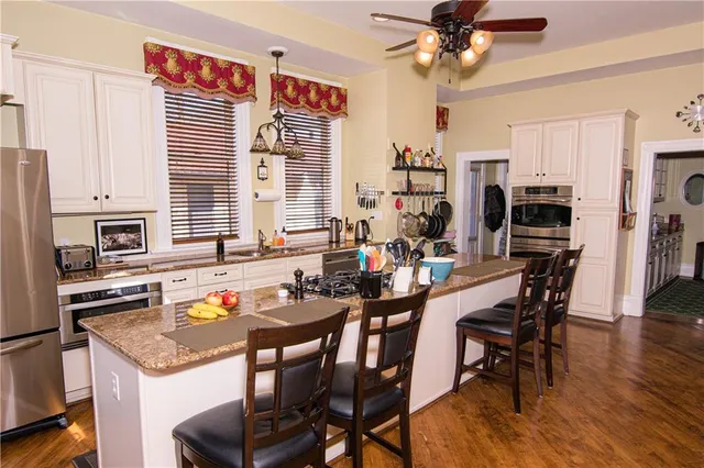 a very nice looking dining room with a large window