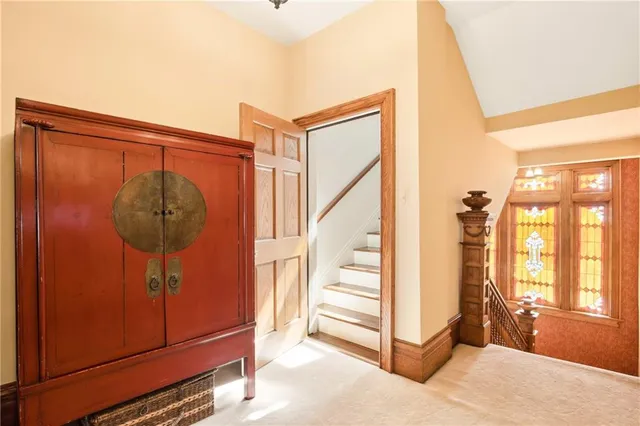 a view of a hallway with seating area
