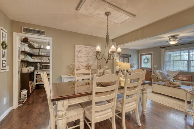 a kitchen with kitchen island granite countertop a sink and cabinets
