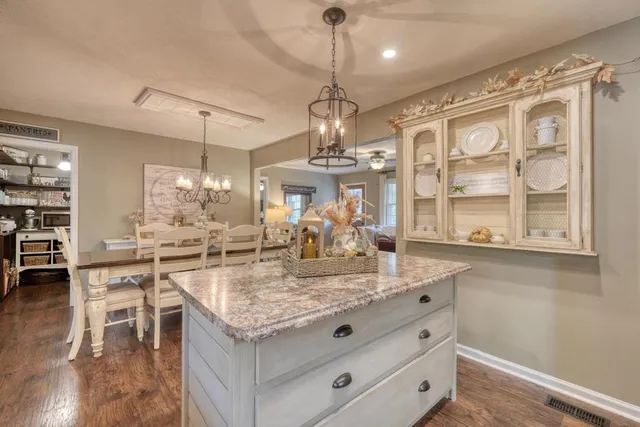 a kitchen with stainless steel appliances granite countertop a stove and a sink