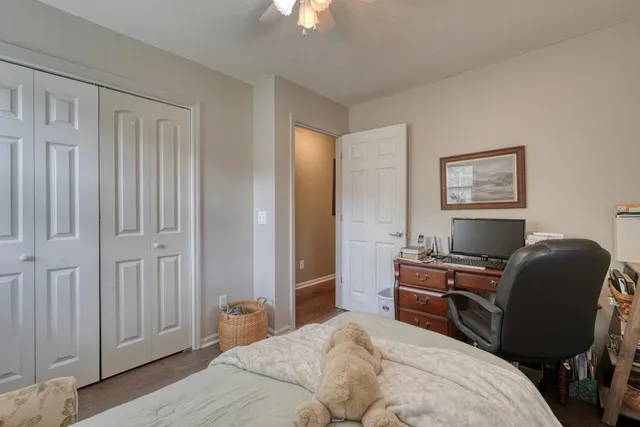 a dining room with furniture and floor to ceiling window