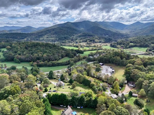 a view of a house with backyard sitting area and garden