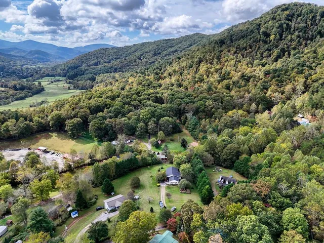 a view of a house with backyard sitting area and garden