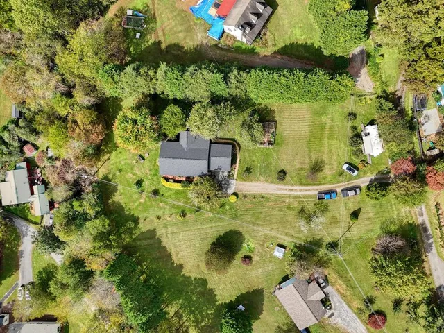 a backyard of a house with lots of green space