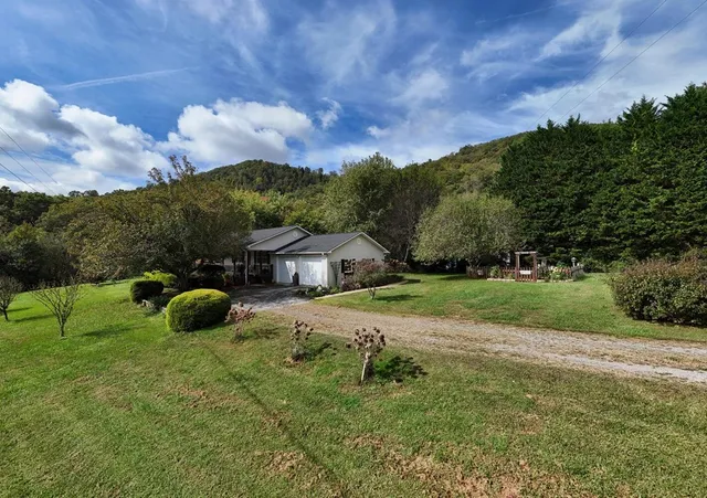 an aerial view of residential house with outdoor space
