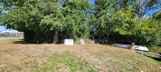 a pathway of a house with a yard