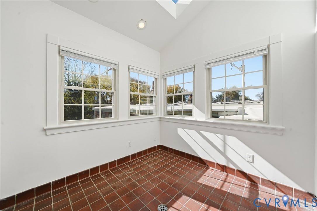 407 West Clay Street, Unit C Richmond, VA 23220 - Photo 10 of 12 Unfurnished sunroom featuring a skylight, lofted c