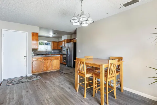 a view of kitchen with granite countertop cabinets and outdoor space
