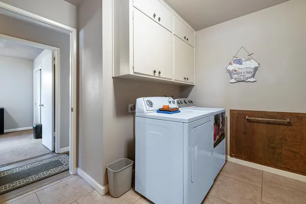 a utility room with cabinets