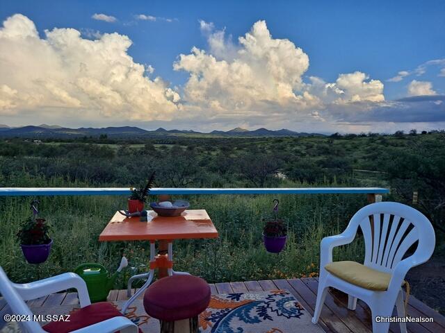 35700 South Cedar Creek Road Arivaca, AZ 85601 - Photo 8 of 44 a view of a chairs and table in patio
