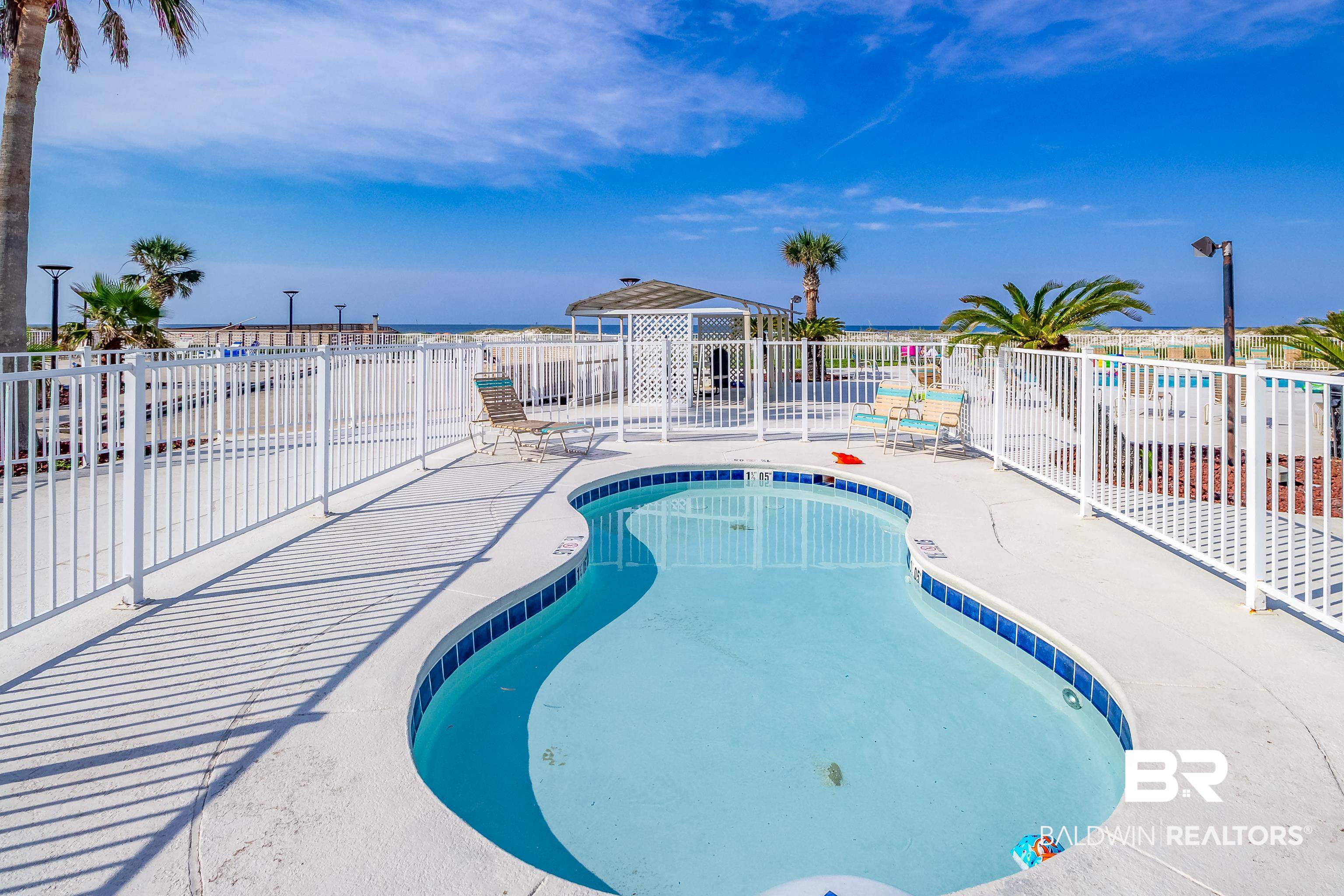 375 Plantation Road, Unit 5514 Gulf Shores, AL 36542 - Photo 28 of 44 Community pool with a patio area and a water view