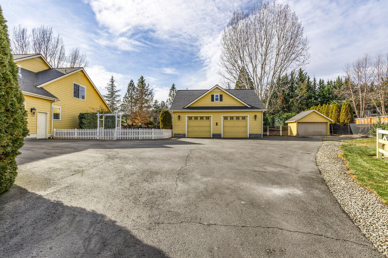 2225 Old Stage Road Central Point, OR 97502 - Photo 28 of 37 a front view of a house with a yard and trees