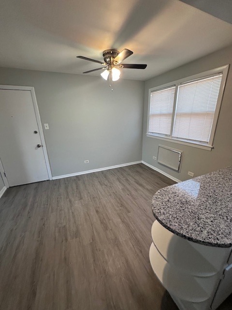 2907 West 59th Street, Unit 3S Chicago, IL 60629 - Photo 4 of 9 wooden floor in an empty room with a window