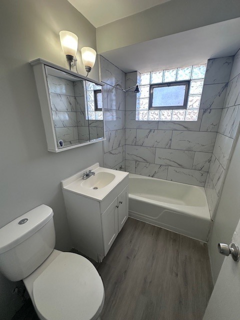 2907 West 59th Street, Unit 3S Chicago, IL 60629 - Photo 9 of 9 a bathroom with a sink a toilet and bathtub