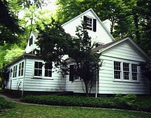 16 Saw Mill Hill Road Ridgefield, CT 06877 - Photo 1 of 1 a house that has a tree in front of the house
