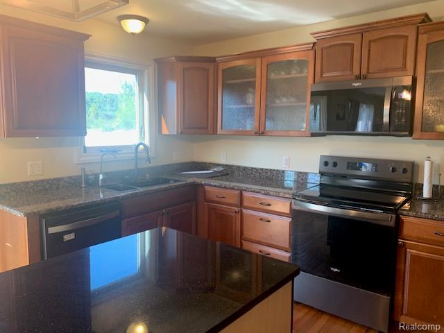 3068 West Cook Road Grand Blanc, MI 48439 - Photo 13 of 31 Kitchen featuring wood cabinetry,