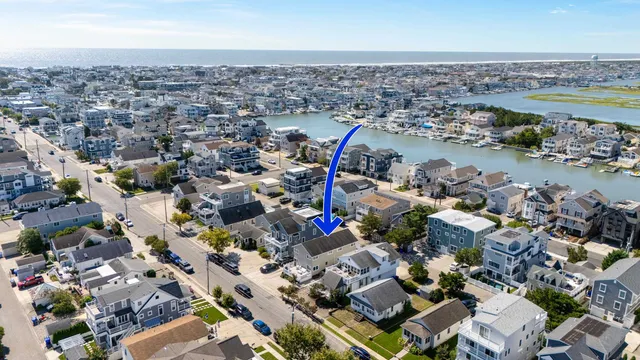 a view of a patio with table and chairs with wooden floor and fence