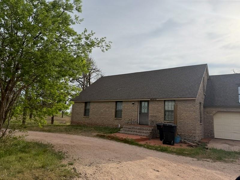 4050 Old Anson Road Abilene, TX 79601 - Photo 1 of 40 a front view of a house with a yard and garage