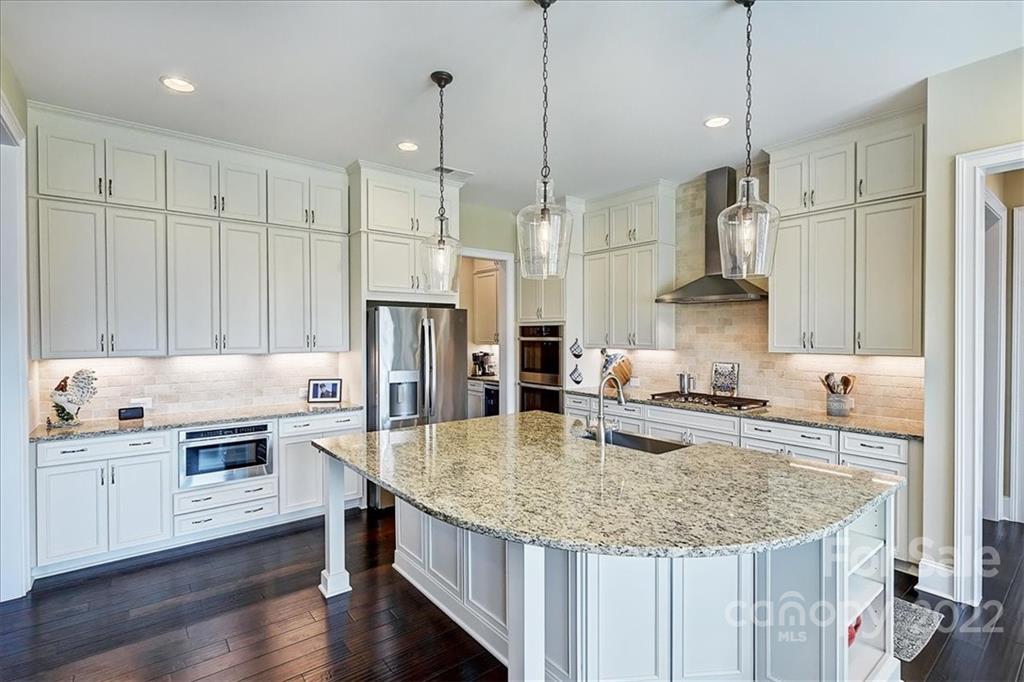 2557 Hidden Shoals Road Fort Mill, SC 29708 - Photo 11 of 30 a kitchen with stainless steel appliances granite countertop a sink a refrigerator and a stove