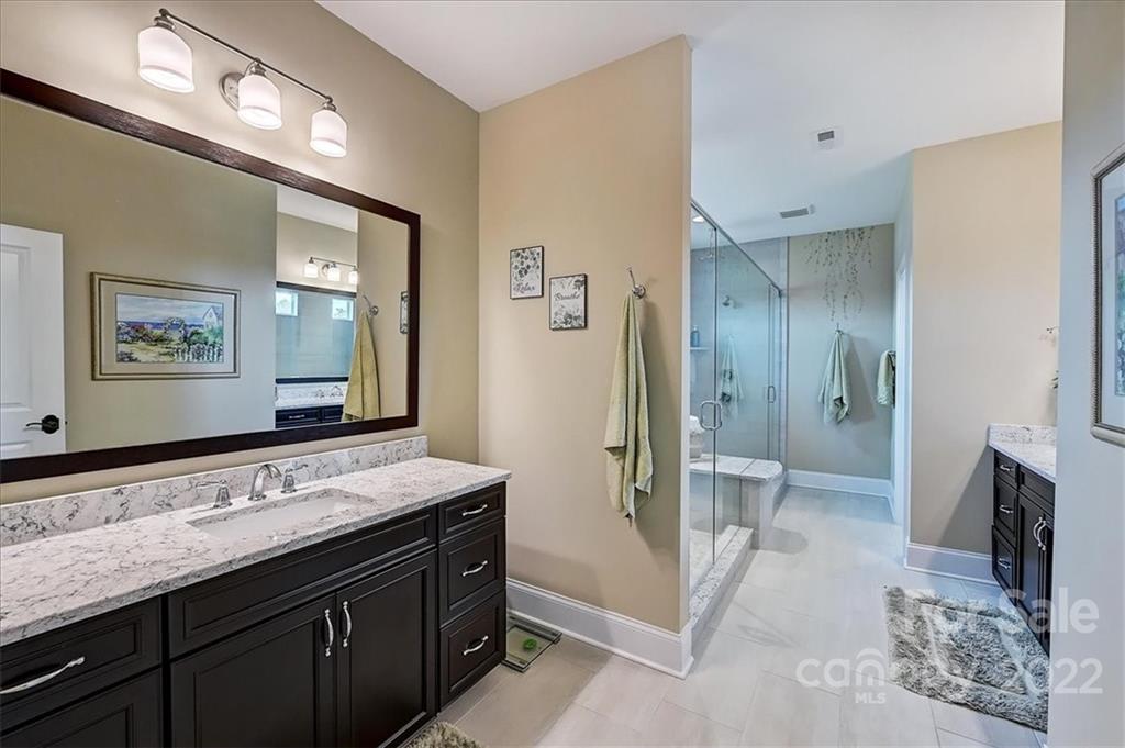 2557 Hidden Shoals Road Fort Mill, SC 29708 - Photo 21 of 30 a bathroom with a sink a toilet and mirror