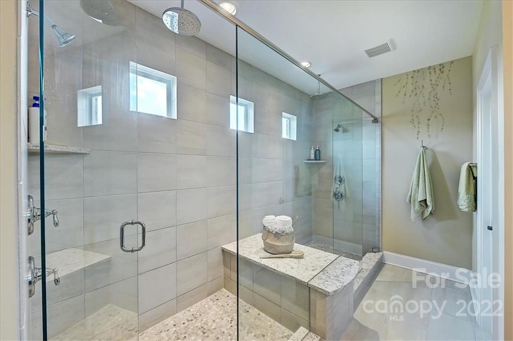 2557 Hidden Shoals Road Fort Mill, SC 29708 - Photo 22 of 30 a bathroom with a granite countertop shower a sink and toilet