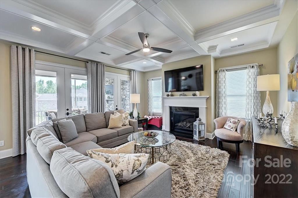 2557 Hidden Shoals Road Fort Mill, SC 29708 - Photo 7 of 30 a living room with furniture fireplace and a large window