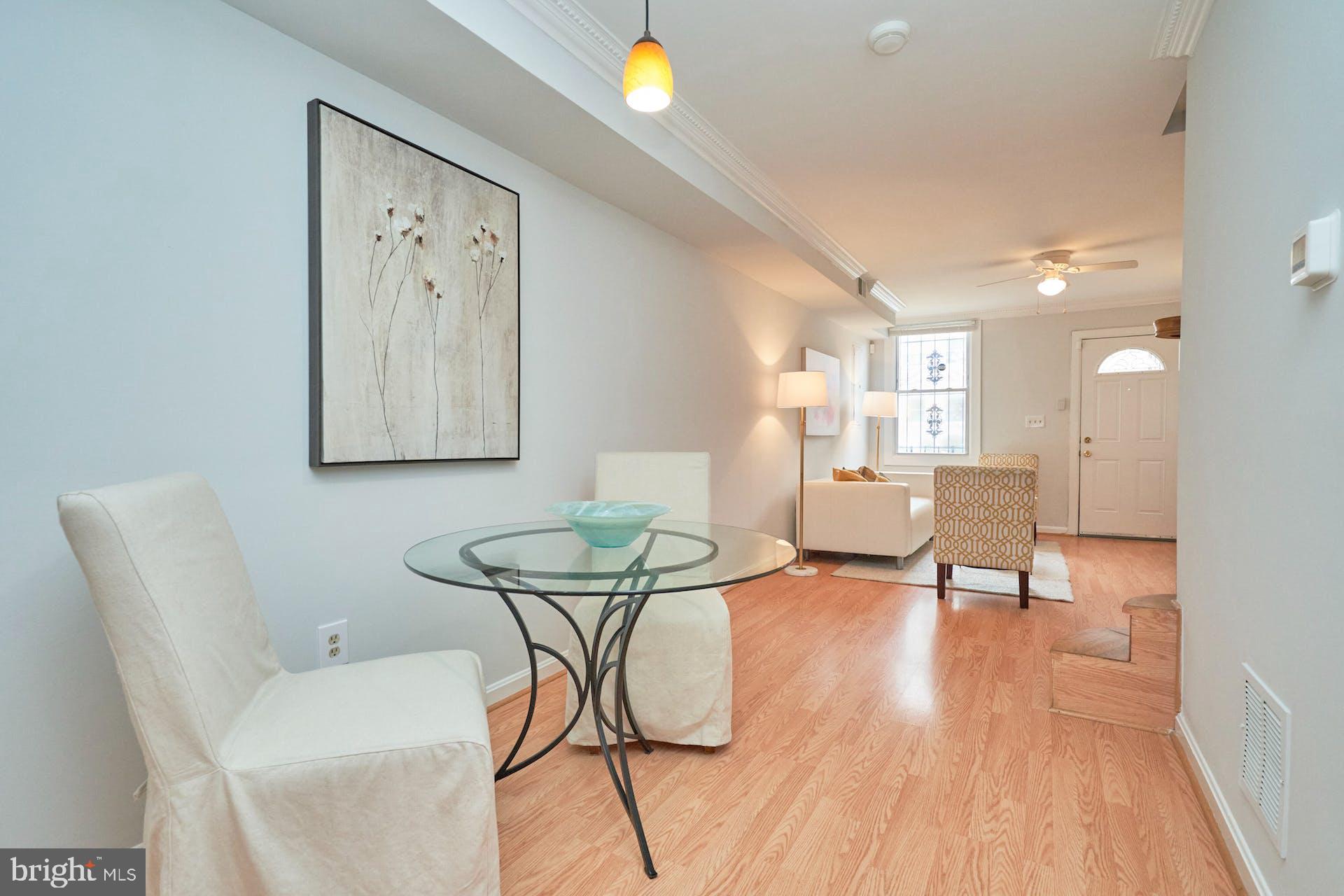 1313 K Street Southeast Washington, DC 20003 - Photo 11 of 48 a view of a dining room with furniture and wooden floor