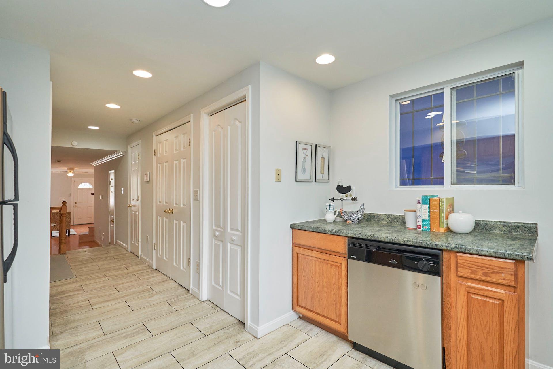 1313 K Street Southeast Washington, DC 20003 - Photo 18 of 48 a kitchen with stainless steel appliances granite countertop a sink and cabinets
